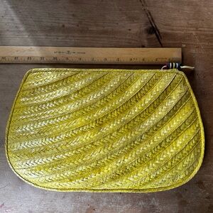 Bright yellow straw clutch brand "Exclusively by Valerie"